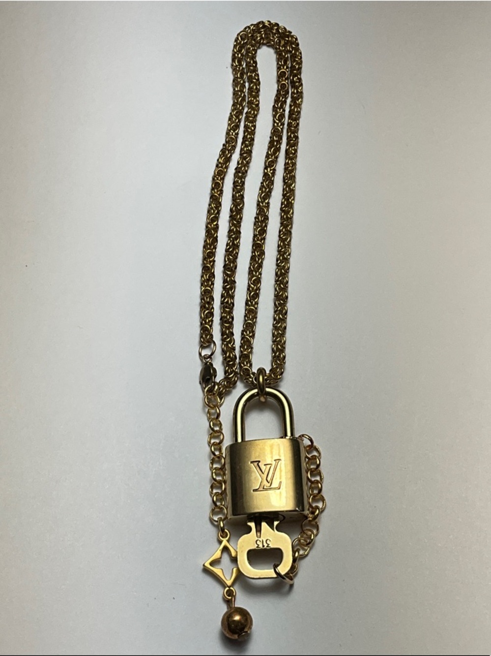 Louis Vuitton Brass Padlock and Key #313 Put on a chain.